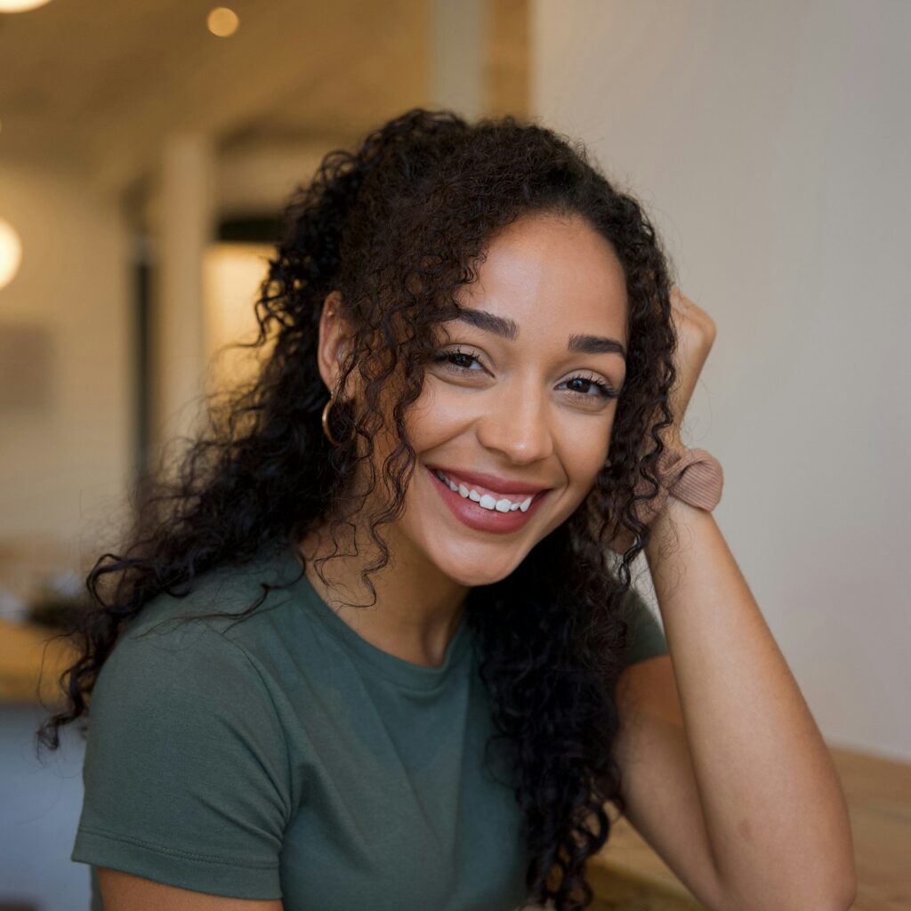 Relaxed, smiling patient sitting at a wooden table