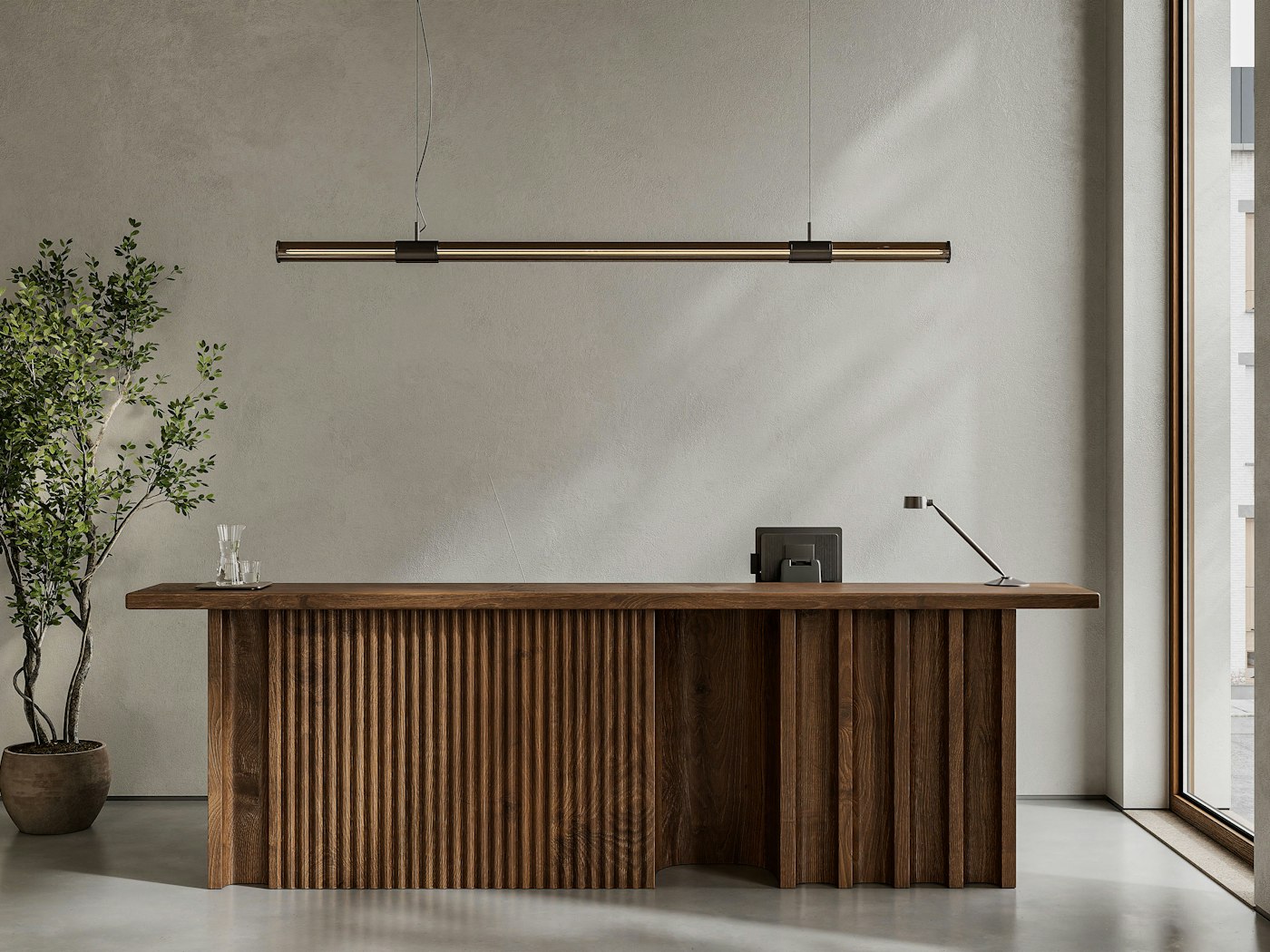 Calm reception desk in warm wood with a potted olive tree